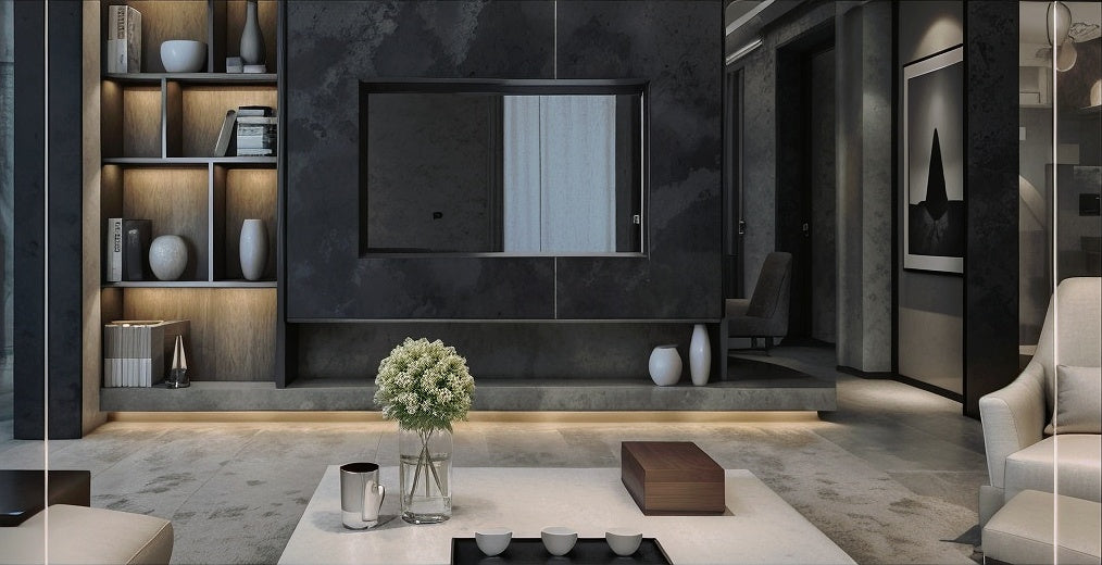Modern living room with a TV on a dark wall and a coffee table with a vase.